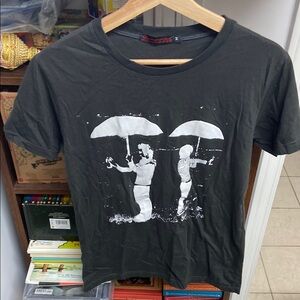Black Graphic T-Shirt with Man & Women holding Umbrellas Silhouette